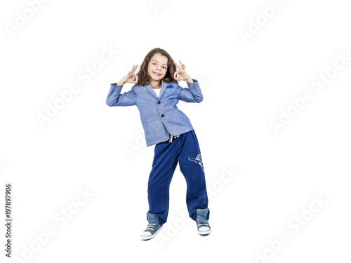 Smiling elemental 7 year old boy thumbs up, isolated on white