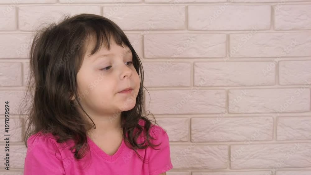 Sick child. A child with a thermometer is given a tablet. Sick child. A child with a thermometer is given a tablet.