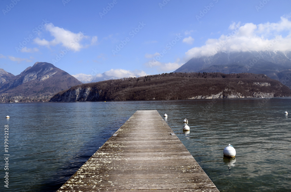 Annecy lake, pontoon and mountains landscape
