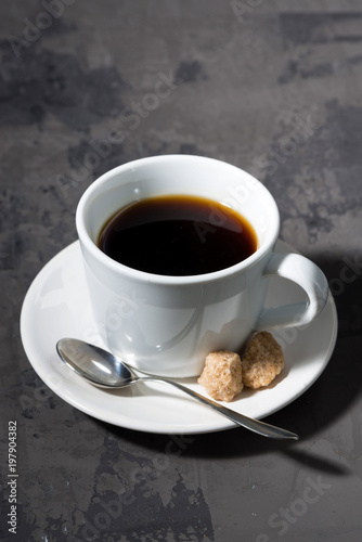 Fototapeta Naklejka Na Ścianę i Meble -  cup of black coffee on a dark background, vertical