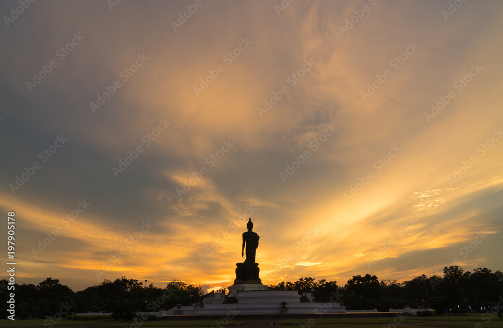Silhouette large buddha in evening.