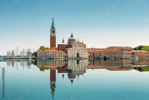 San Giorgio Maggiore island in Venice, Italy. Mirror reflection in water of Venetian lagoon. photo