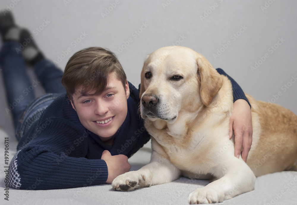 teenager boy and yellow labrador teenager boy and yellow labrador