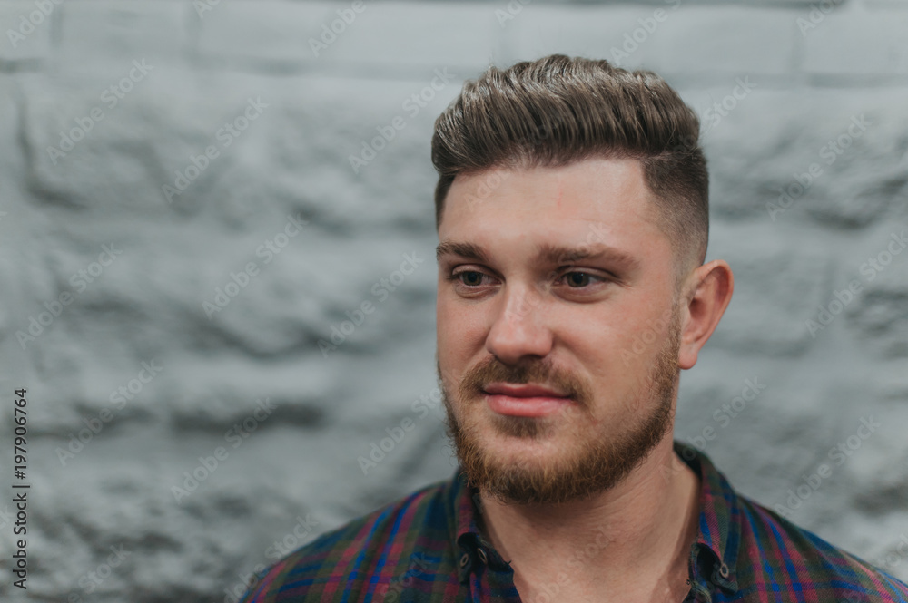 Fototapeta premium A man in a barber shop for haircuts and shaving