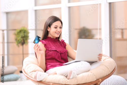Beautiful woman with credit...