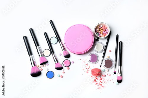 Decorative makeup products on white background