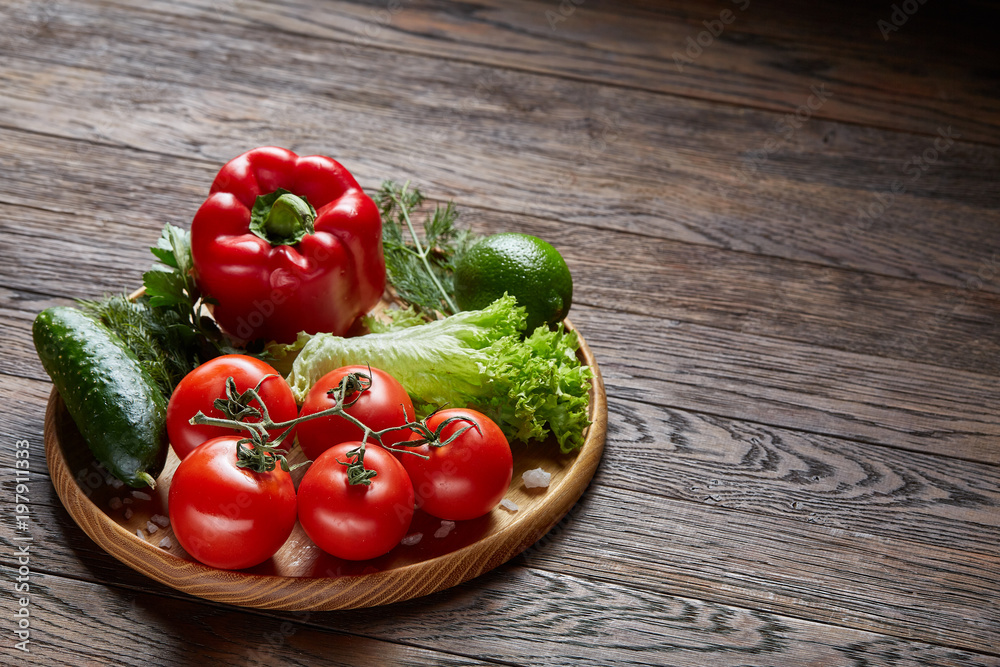 Close-up still life of assorted fresh vegetables and herbs on vintage wooden background, top view, selective focus. Close-up still life of assorted fresh vegetables and herbs on vintage wooden background, top view, selective focus.