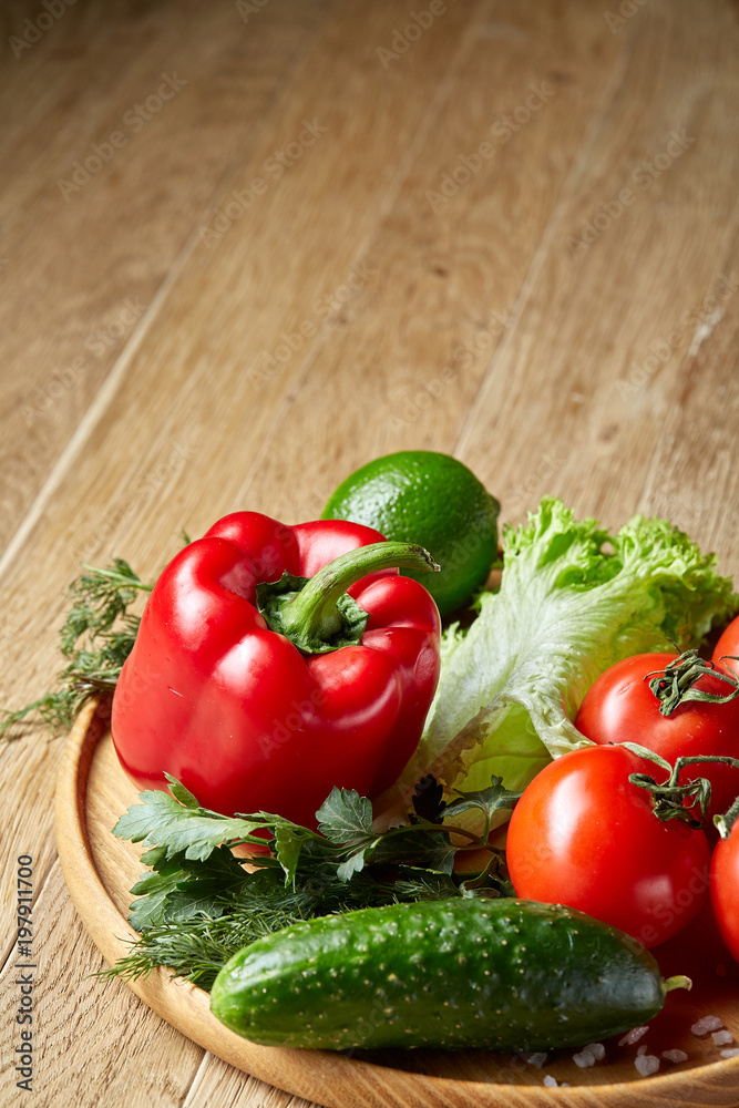 Close-up still life of assorted fresh vegetables and herbs on vintage wooden background, top view, selective focus. Close-up still life of assorted fresh vegetables and herbs on vintage wooden background, top view, selective focus.