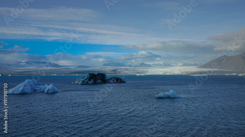The Glacier at Jokulsarlon Glacial Lagoon with floating blue iceberg