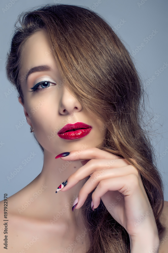 Fototapeta premium Beautiful woman with sexy red lips and fashion color eye makeup.