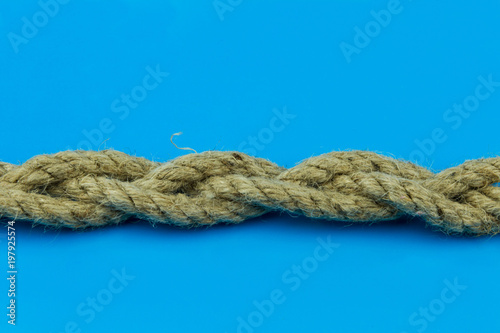 coconut rope binding of three pieces on a blue background is horizontal