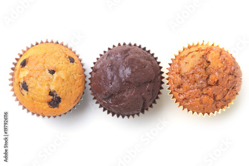 Assorted with Delicious homemade cupcakes with raisins and chocolate isolated on white background. Muffins. Top view.