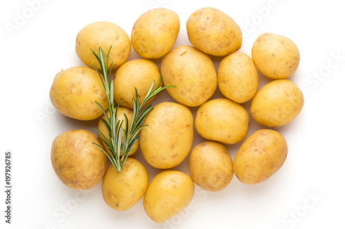 New potato and rosemarin isolated on white background close up.