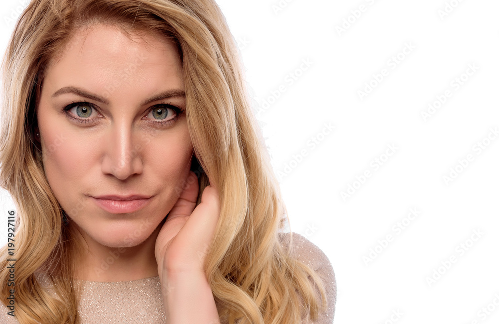 Attractive cute blonde. Close-up portrait on a white. Beautiful young woman in a flesh-colored dress. Attractive cute blonde. Close-up portrait on a white. Beautiful young woman in a flesh-colored dress.