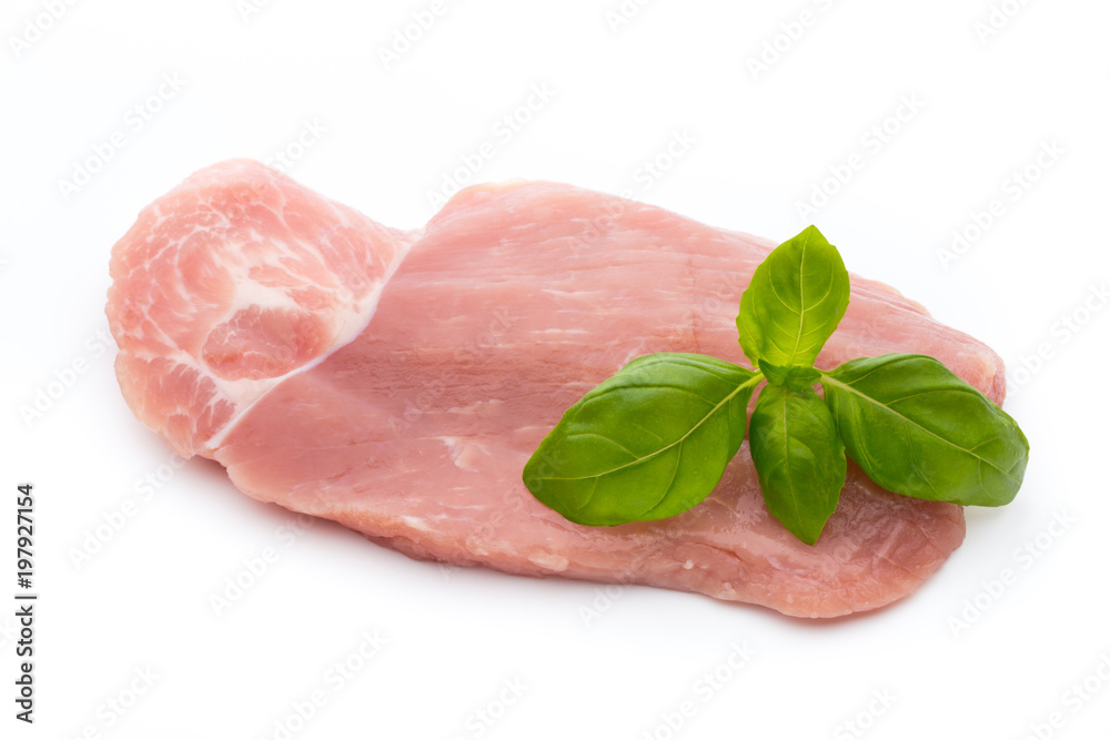 Fresh pork fillet with basil on a white background. Fresh pork fillet with basil on a white background.