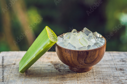 Aloe vera and aloe cubes in a wooden bowl. Aloe Vera gel almost use in food, medicine and beauty industry