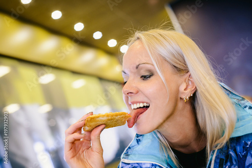 The girl in the cafe stuck out her tongue and licked the pie.