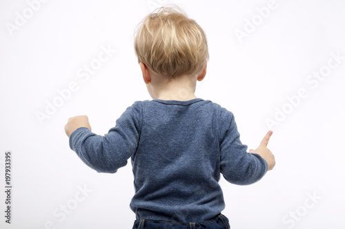 two years toddler on white background. back view