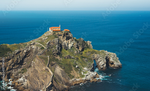 Sea scape on background gaztelugatxe steps sun huan, nature horizon ocean, relax holiday, blank space blue waves view, travel trip on Basque country in Spain, popular place of movies