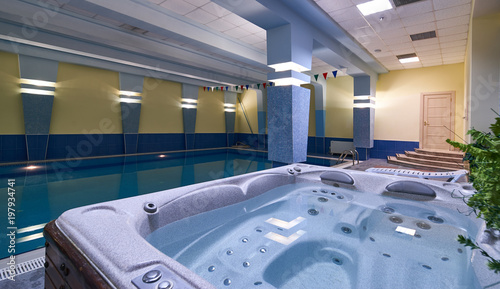 Indoors swimming pool in modern gym fitness spa