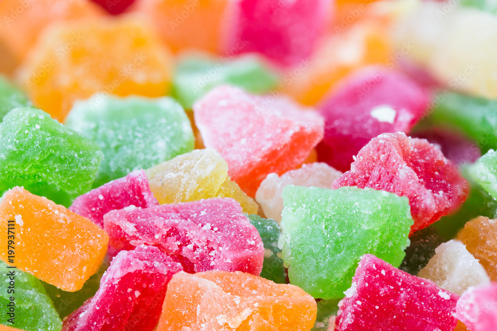The candied pieces of dried fruit close up. The candied pieces of dried fruit close up.