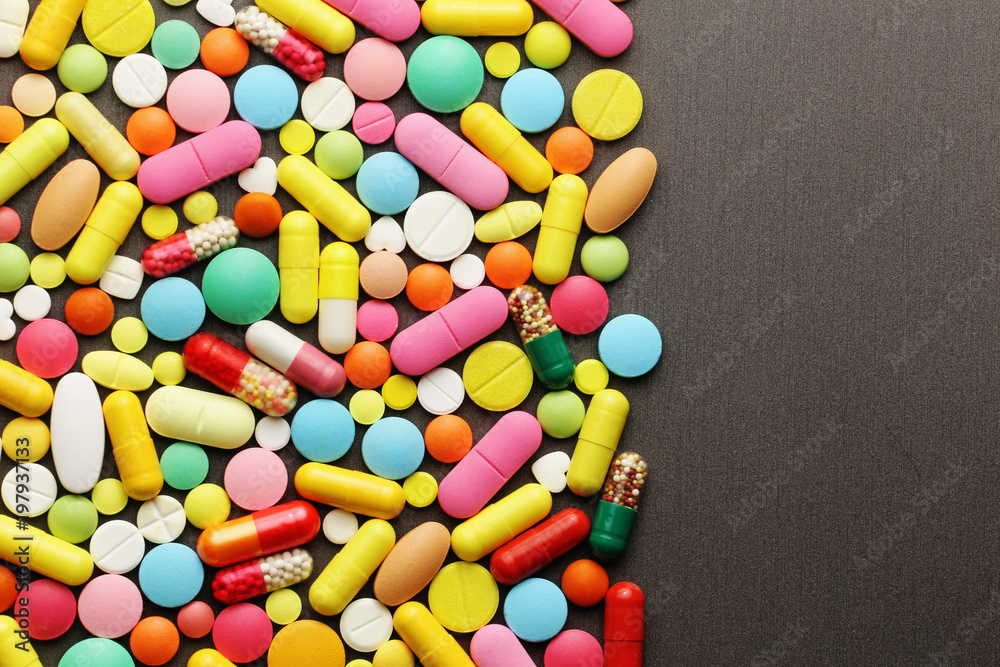 Colorful pills on grey background Colorful pills on grey background