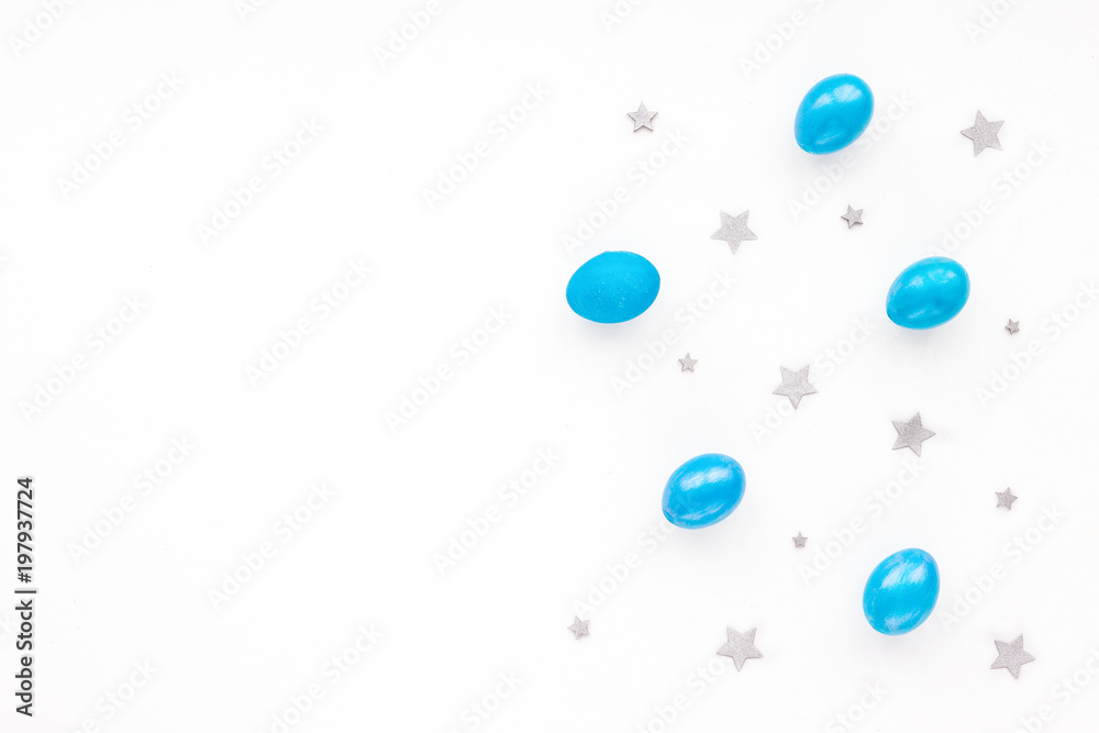 Blue easter eggs on white background. Flat lay, top view