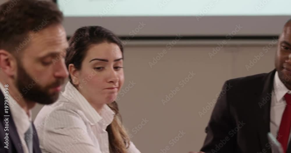 Team of multi ethnic business people in a meeting. Slow motion. Team of multi ethnic business people in a meeting. Slow motion.