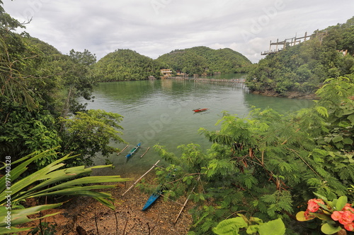 Blue red boats-bay between Latasan and Tinagong Dagat islands. Sipalay-Philippines. 0351 photo