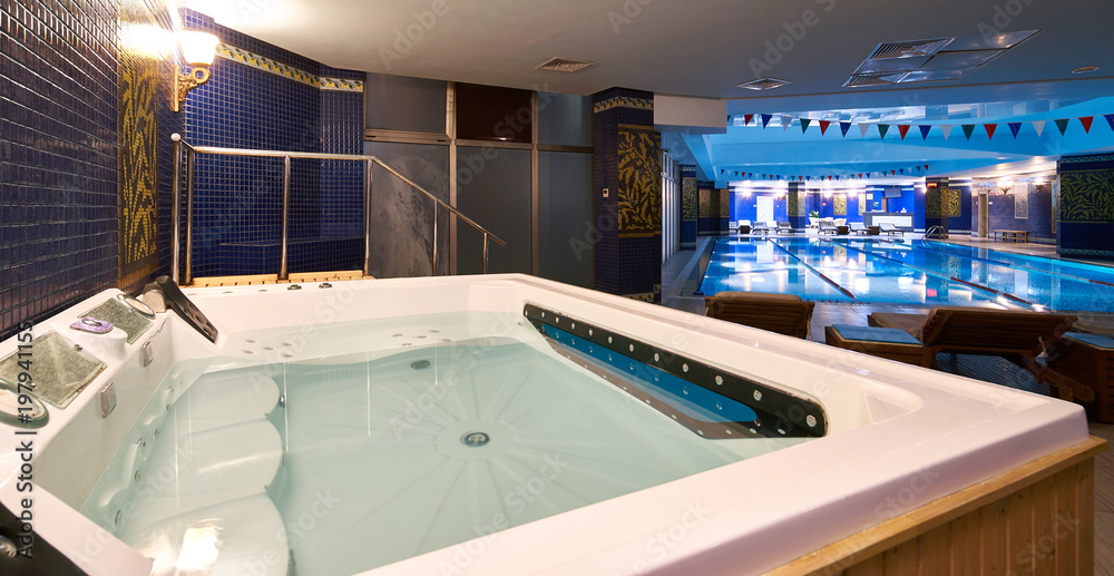 Interior of public swimming pool in a luxury fitness gym.