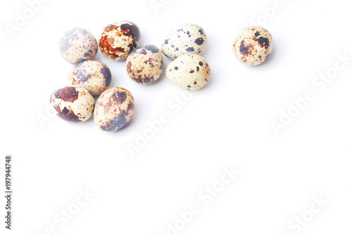 nine quail eggs on a white background. preparation for Easter