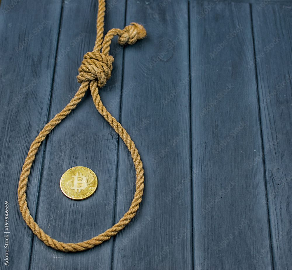 End of bitcoin. Coin bitcoin in the loop of the gallows.