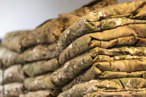 Field camouflage clothing on the shelf of a specialized warehouse-store for police and military uniforms, as well as insignia for officers of the Russian law enforcement agencies.