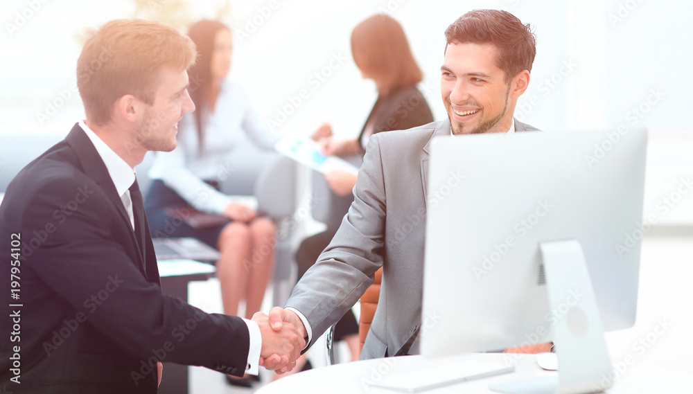 handshake Manager and the client in the office. handshake Manager and the client in the office.
