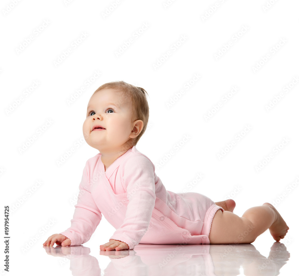 8 month infant child baby girl toddler lying in white shirt looking up 8 month infant child baby girl toddler lying in white shirt looking up