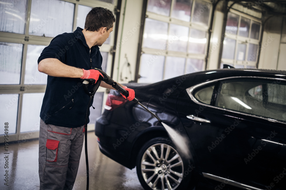 Man working on a car wash.