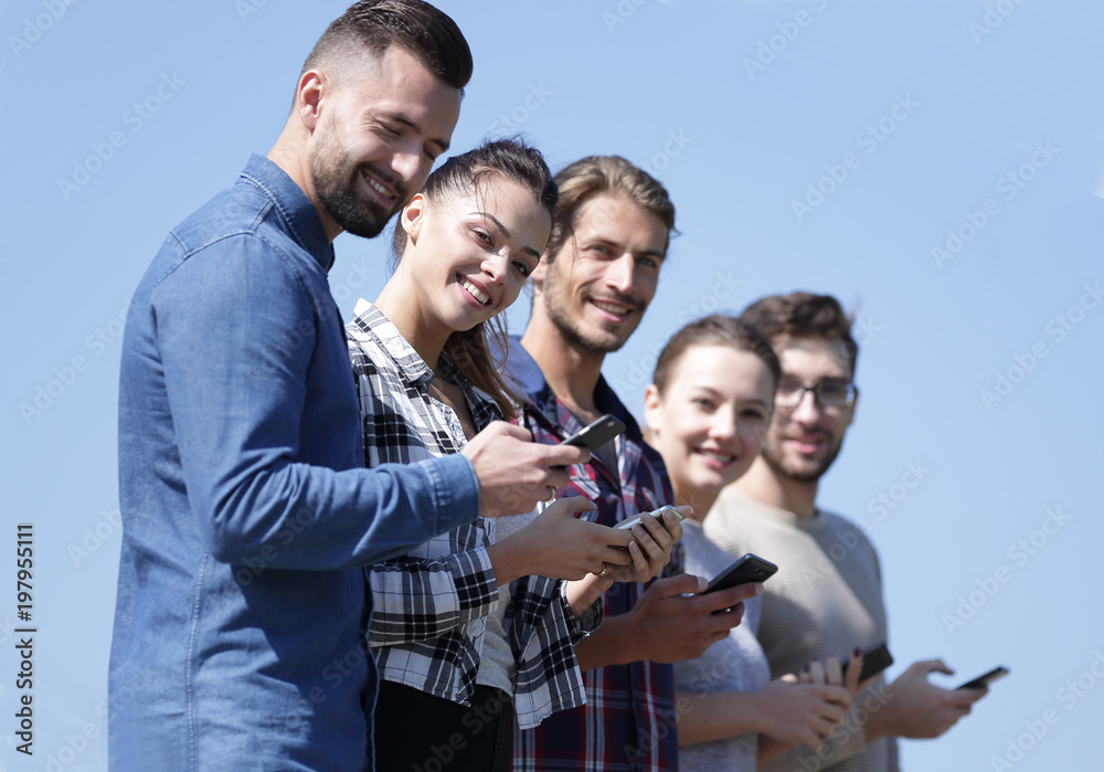 group of young people with modern smartphones.