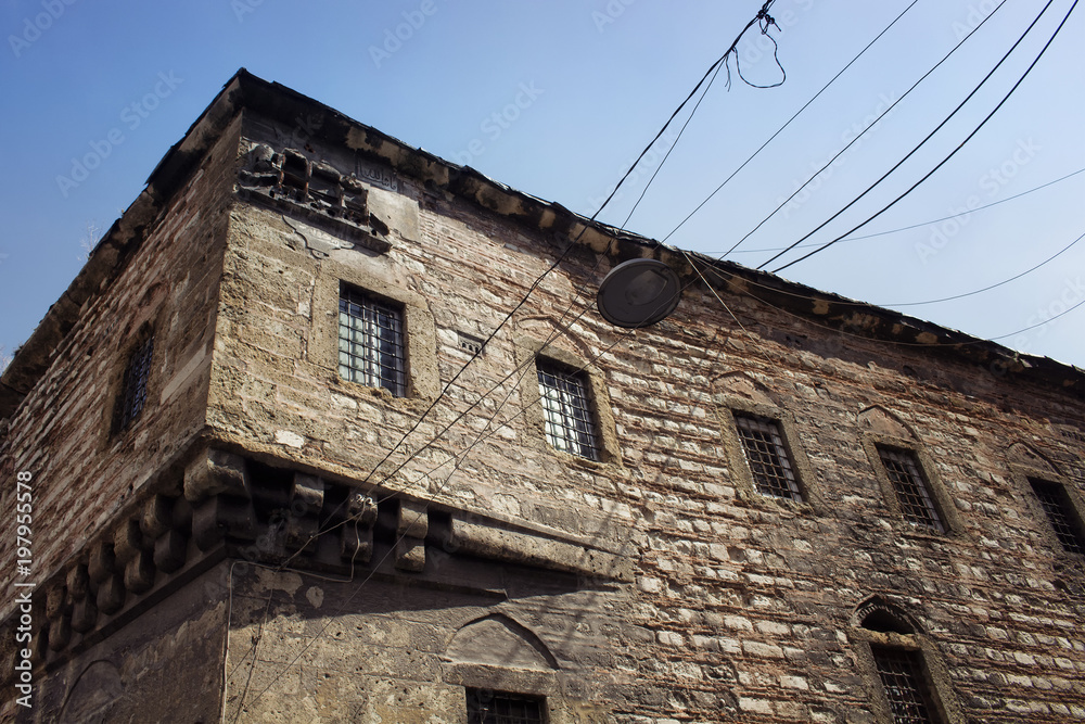 Bottom view of historical, stone building in Eminonu/Sirkeci area of Istanbul.