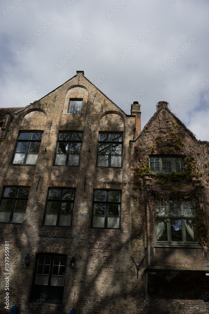 A red brick house with a gable in the city if Bruges, Belgium A red brick house with a gable in the city if Bruges, Belgium