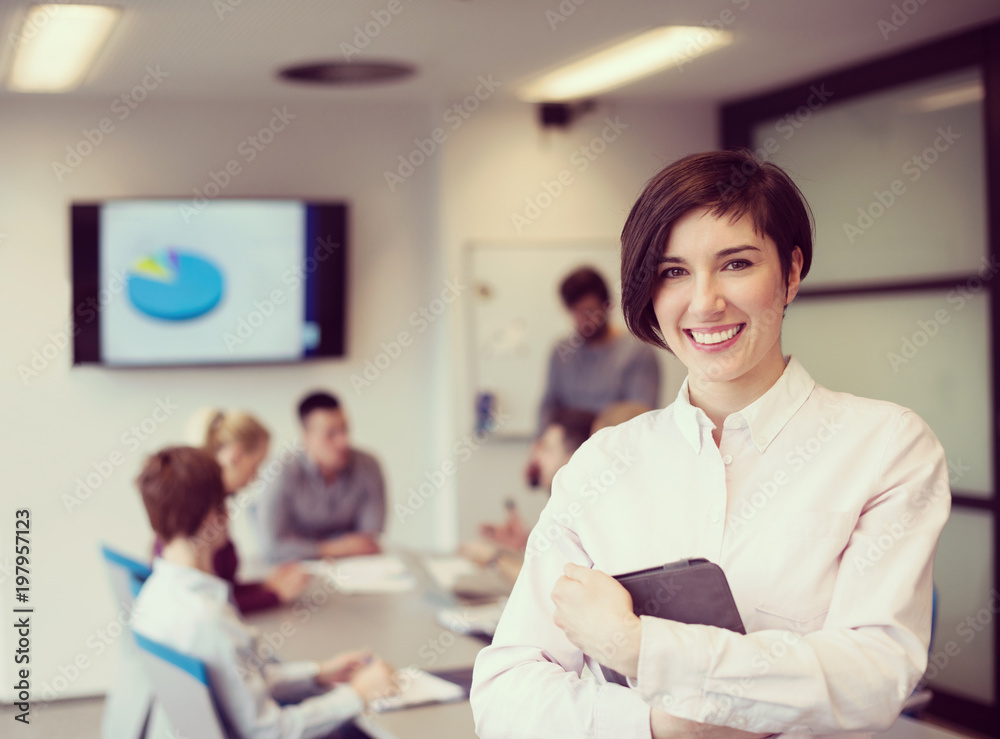 Fototapeta premium hispanic businesswoman with tablet at meeting room