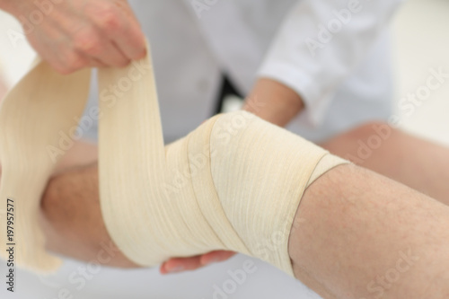 closeup. doctor bandaging a patient's leg