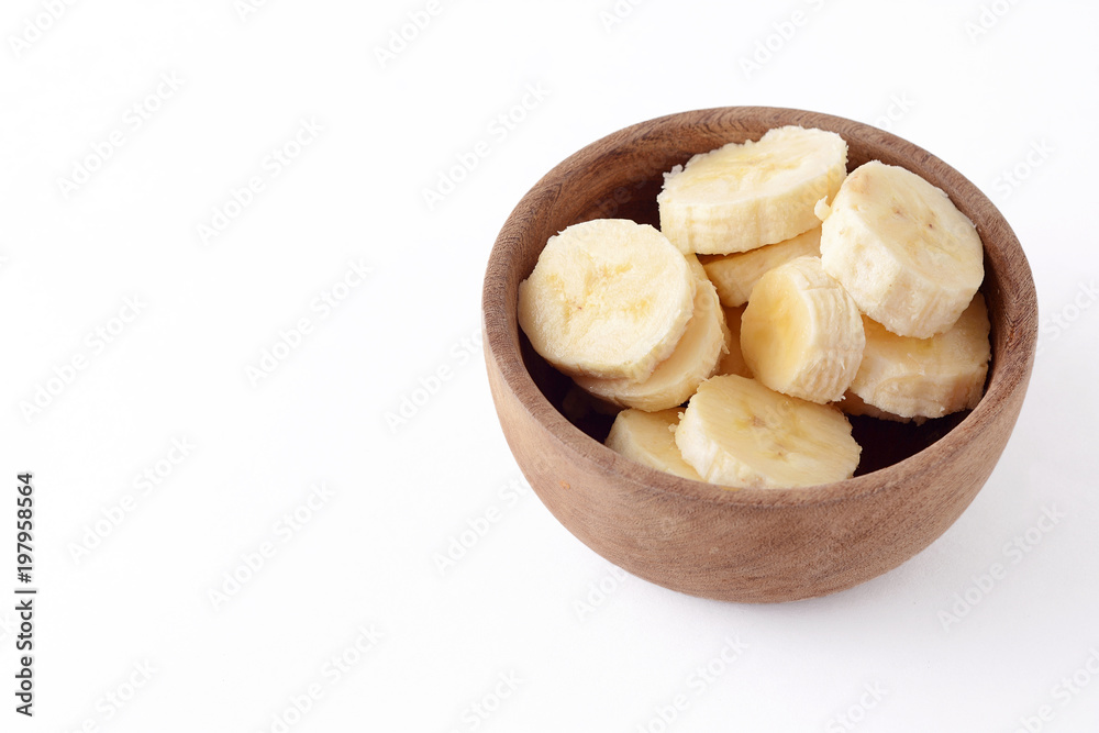 Close up view of wooden bowl with banana slices Close up view of wooden bowl with banana slices