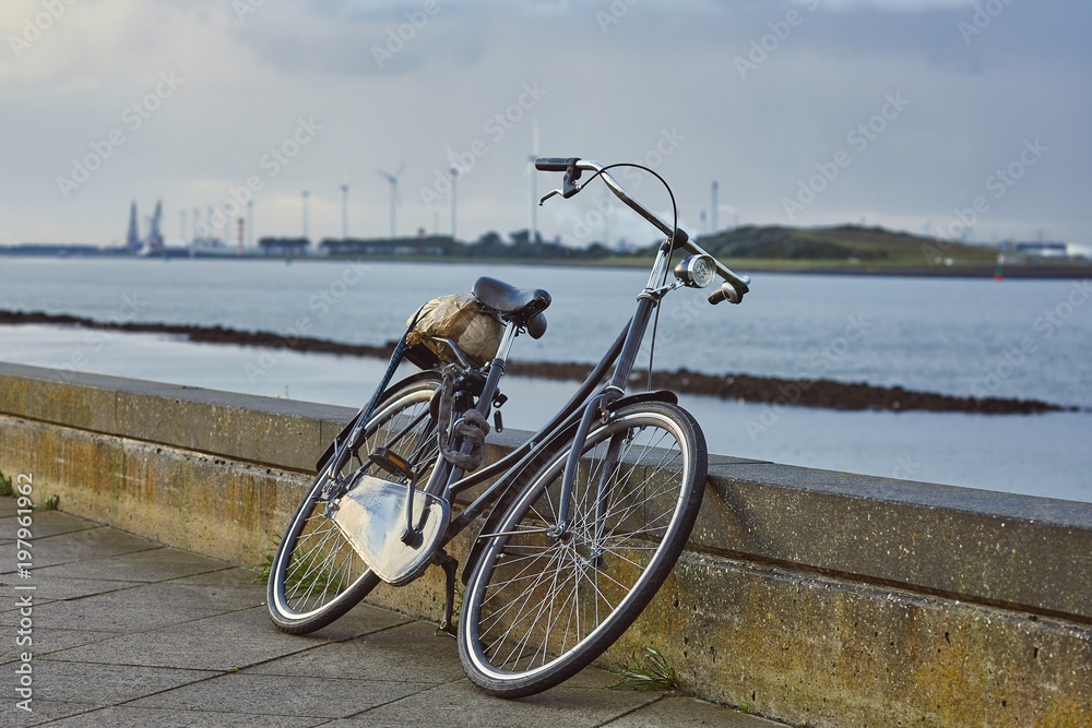 Bicycle on the road along the river Bicycle on the road along the river