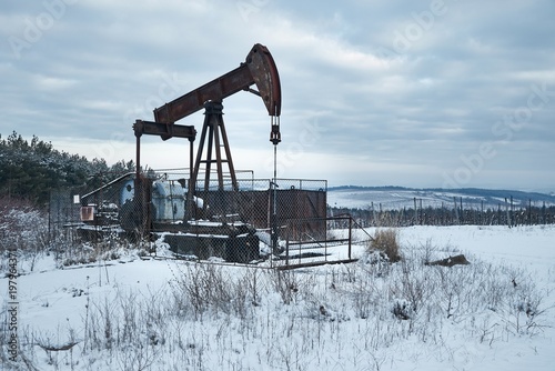 Oil well on a winter landscape