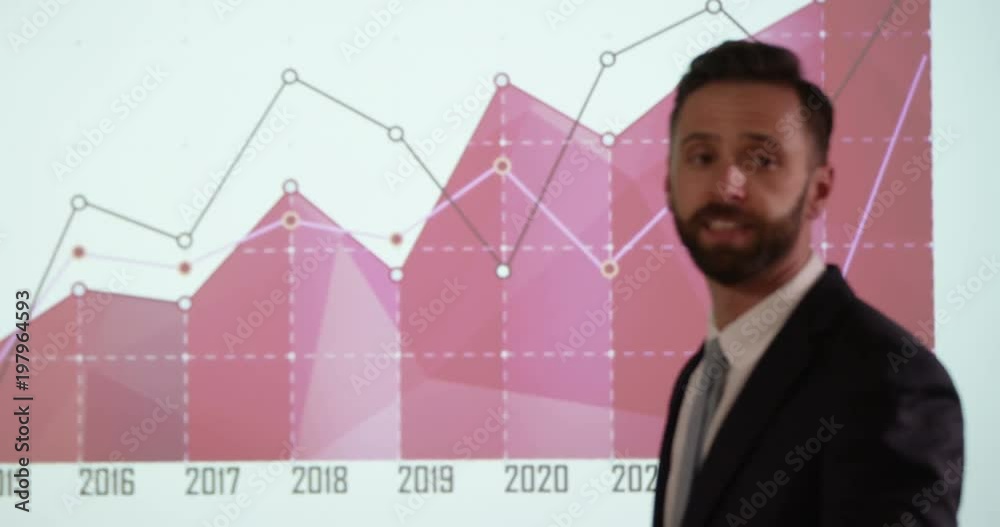 A confident businessman presenting a financial report to his team. A confident businessman presenting a financial report to his team.