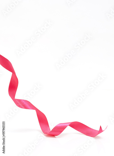 Pink curly ribbon on white