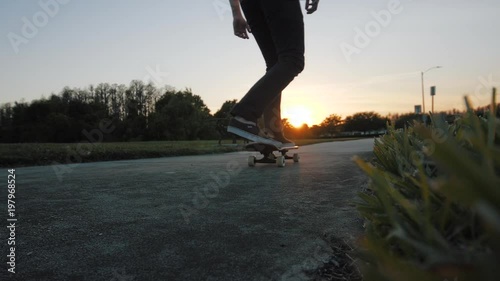 Guy Skateboarding on Sidewalk at Sunset Closeup - Slow Motion