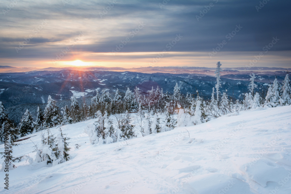 sunrise in snowy mountains
