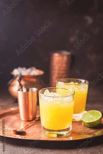 Orange cocktail decorated with lime
