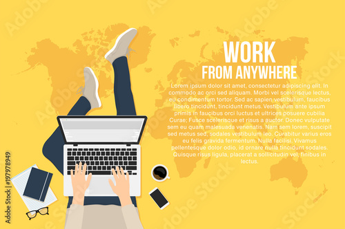 Freelancer is working at home with laptop, top view. Concept of remote working and work from anywhere. Man is typing on the laptop and sitting on the floor